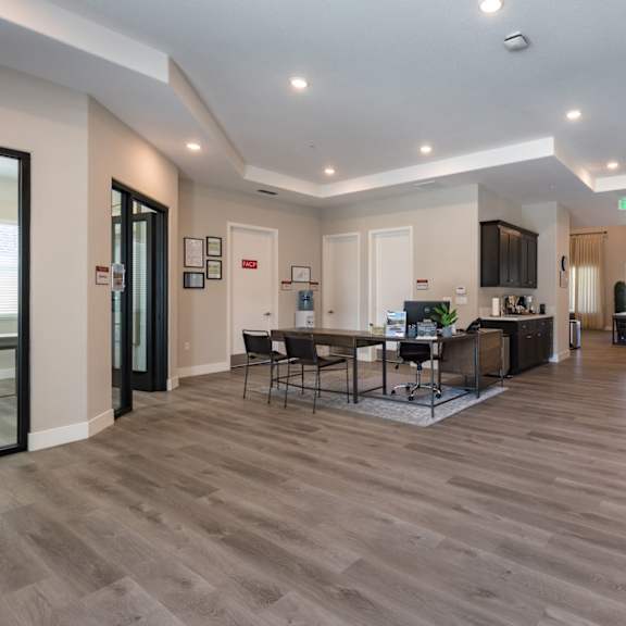 a living room and dining room with a table and chairs at heritage landing apartments, chico, california