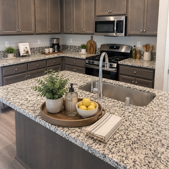 a kitchen with granite countertops and a sink.