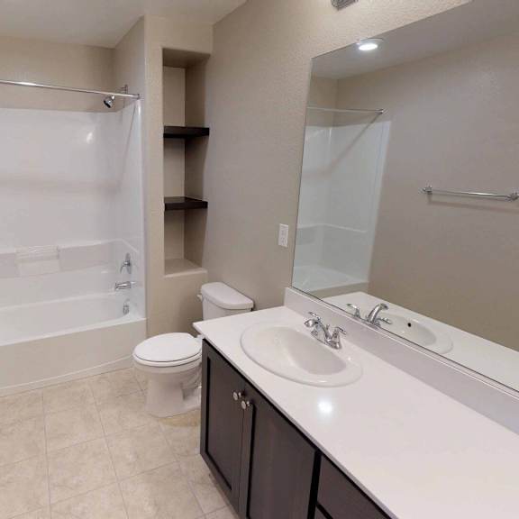a bathroom with a sink and a shower and a toilet at edgewater, pittsburg california 