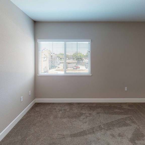 an empty room with a window and carpet at edgewater, pittsburg, ca 94565  