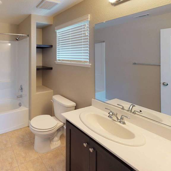 a bathroom with a sink toilet and a shower at edgewater, pittsburg, ca  