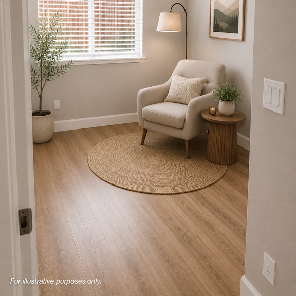 a cozy room with a chair, a small table, and a plant.