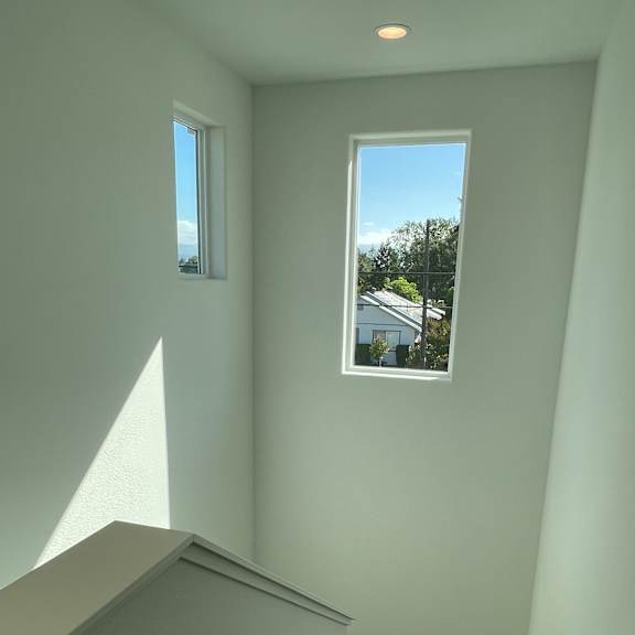 a room with a window and a skylight.