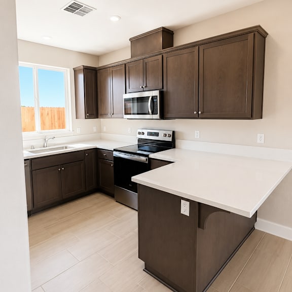 a kitchen with brown cabinets and a white counter.