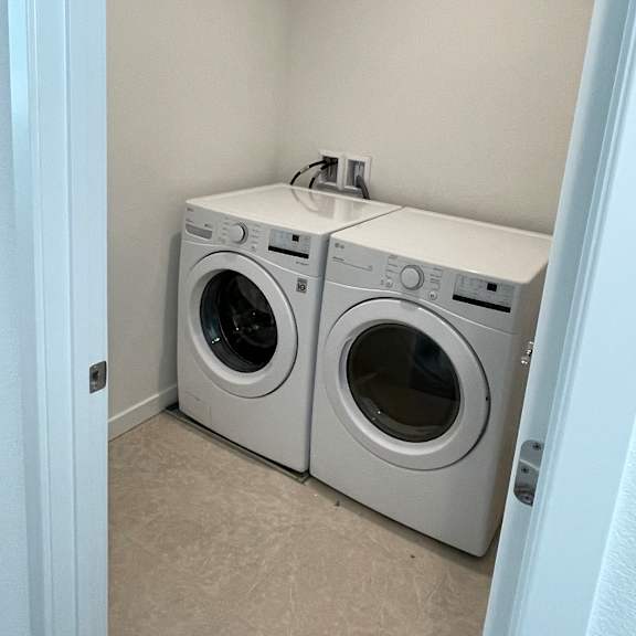 a washing machine is installed in a wall.
