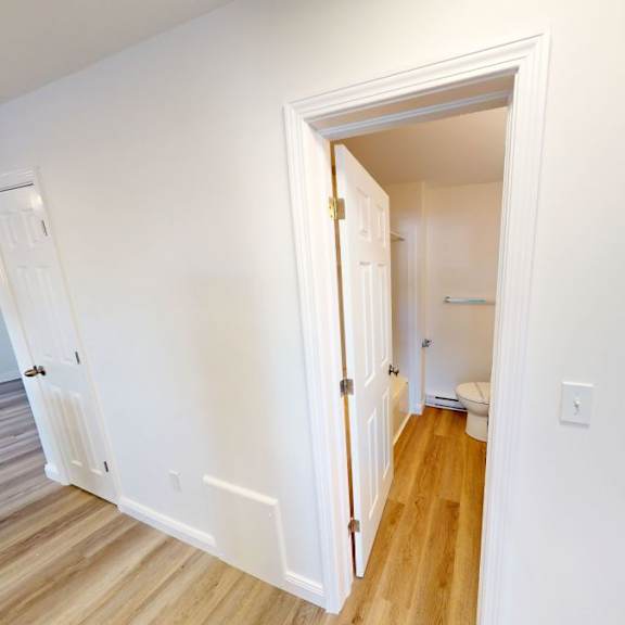 a white doorway leads to another room.