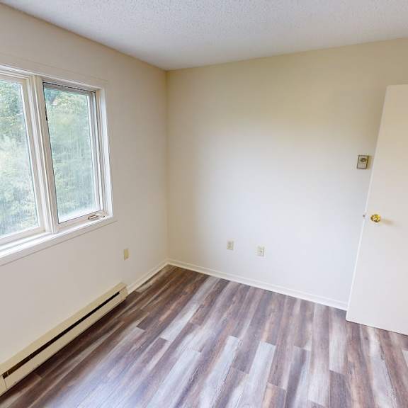 a room with a window and a door.