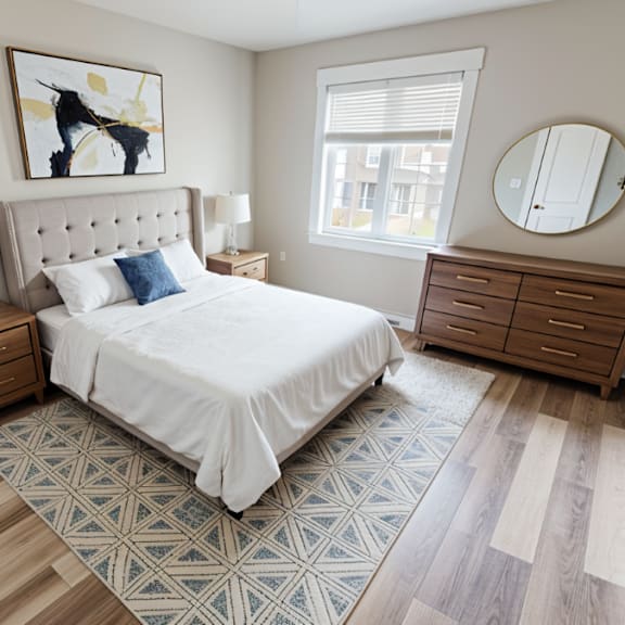 a bedroom with a bed, nightstand, and dresser.