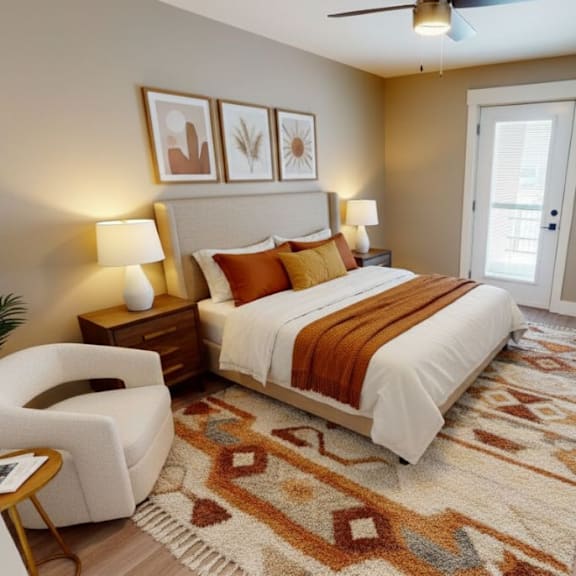 a bedroom with a bed, chair, and a rug.
