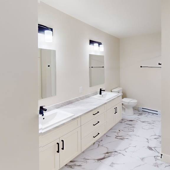a bathroom with a marble floor and white walls.