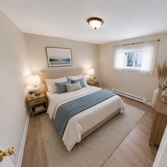 a bedroom with a bed, nightstands, and a window.