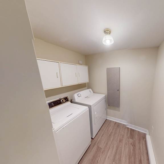 a small laundry room with a washer and dryer.
