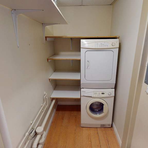 a small laundry room with a washer and dryer.