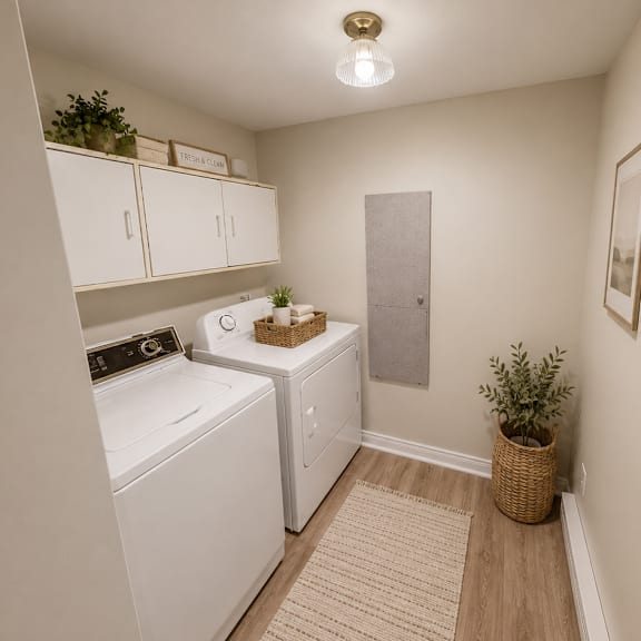 a small laundry room with a washer and dryer.