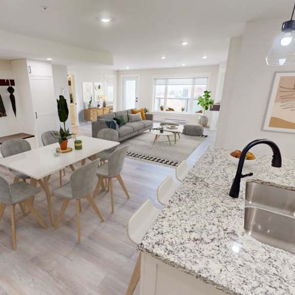 a modern kitchen with a dining table and chairs.