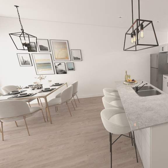 a modern kitchen with white cabinets and a central island.