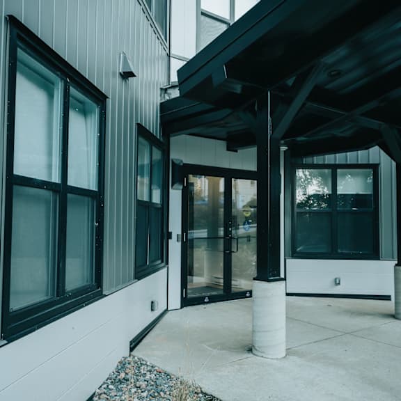 a modern building with a covered walkway.