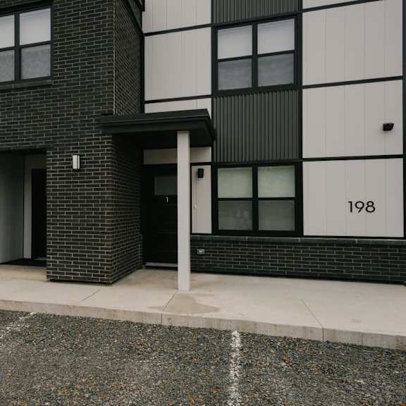 a black and white building with the number 198 on it.