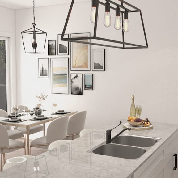 a modern kitchen with a dining table set for four.