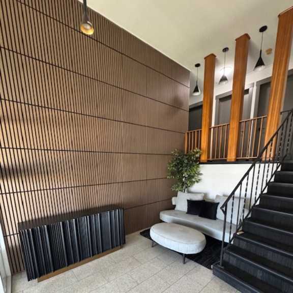 a staircase with a metal railing and wooden steps.