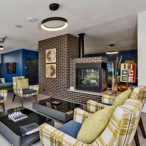 a living room with a fireplace and a sofa.
