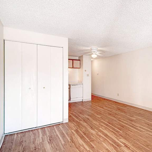 a room with a white wall and a white closet.
