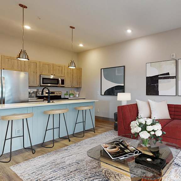 a modern living room with a red couch and a coffee table.