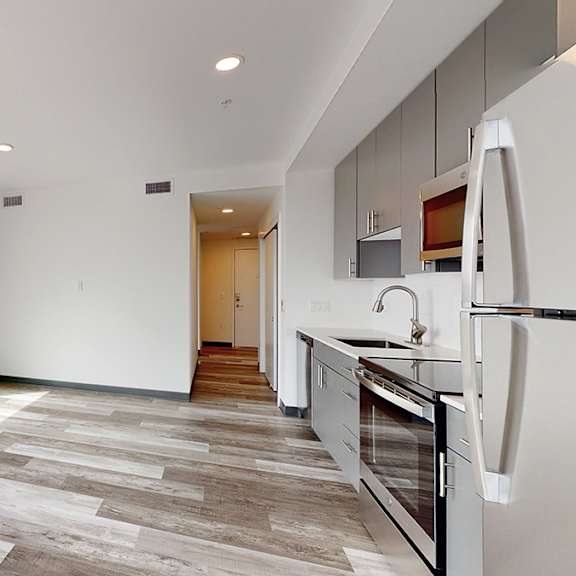 a modern kitchen with a view of the city.