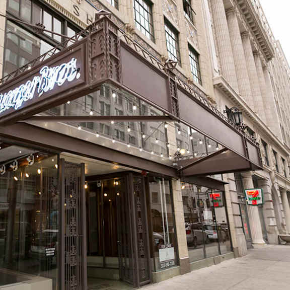 brown building with a sign that says "brownstone hotel".