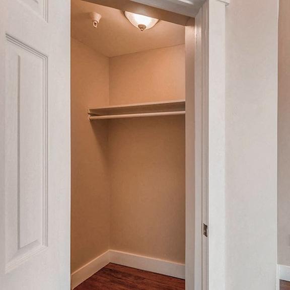 a small, empty room with a doorway leading to another room.