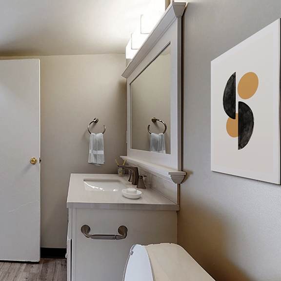a bathroom with a white sink and a mirror.
