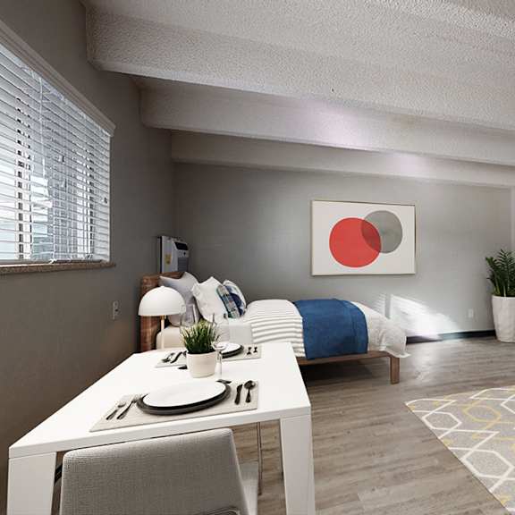 a modern living room with a dining table and a couch.