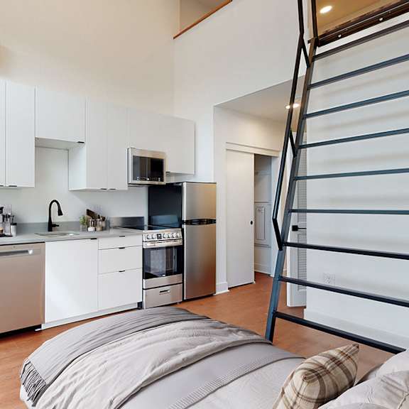 a modern kitchen with a dining table and chairs.