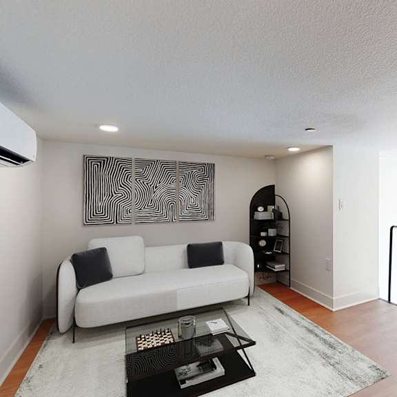 a modern living room with a white couch and a coffee table.
