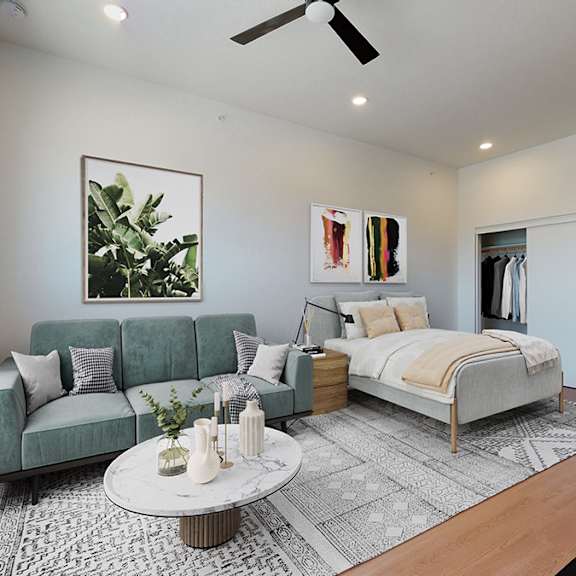 a modern bedroom with a green couch and a white bed.