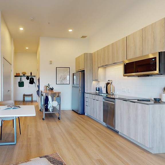 a kitchen with a table and chairs in the middle of the room.