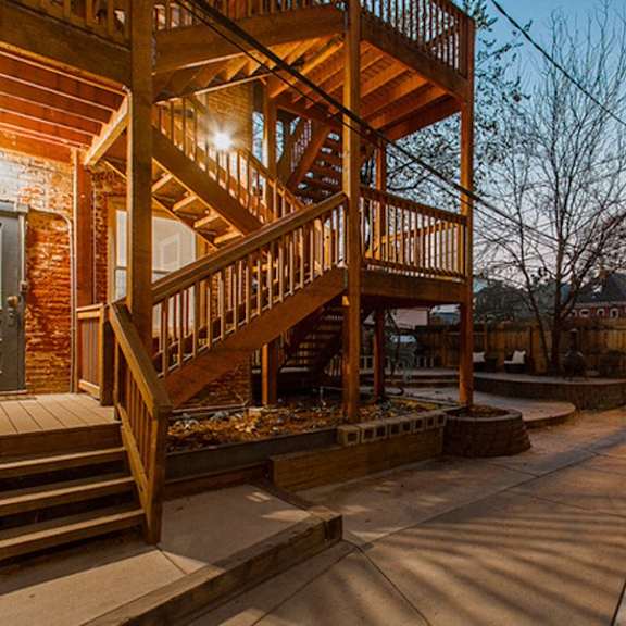 a wooden staircase with a light on it.