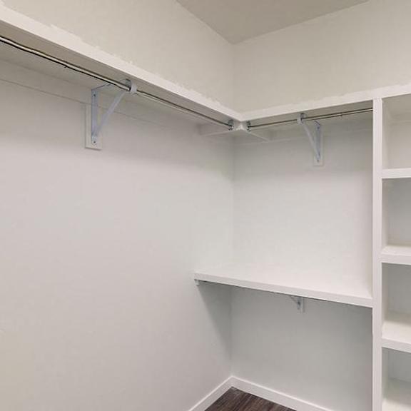 empty white shelves in a room.