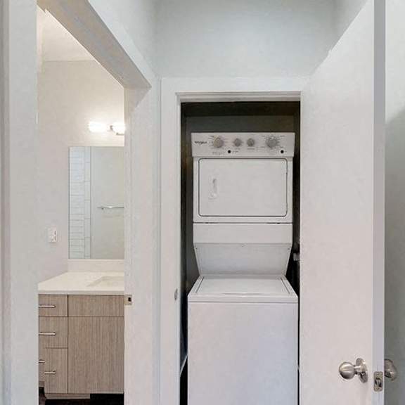 a white oven and dishwasher in a kitchen.