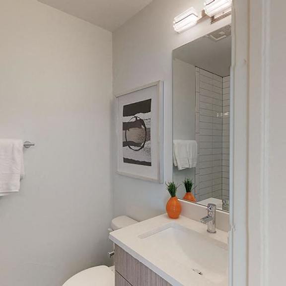 a bathroom with a white towel hanging on the wall.