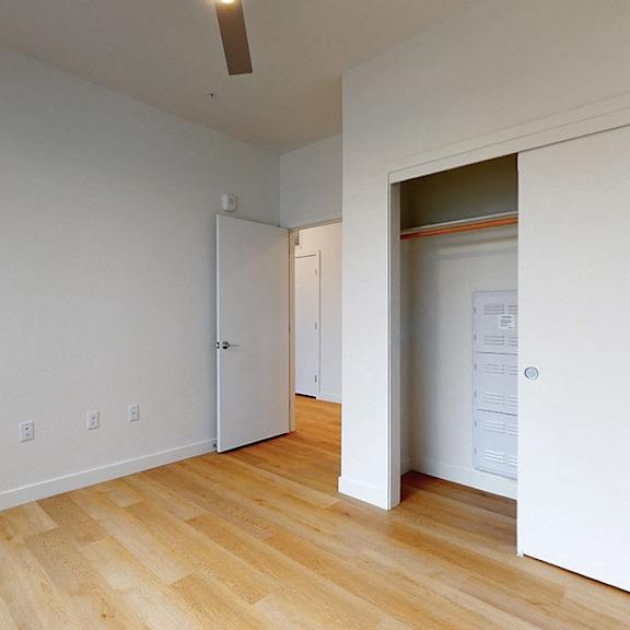 a room with a white wall and a white door.