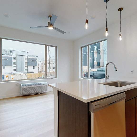 a kitchen with a dishwasher and a sink.