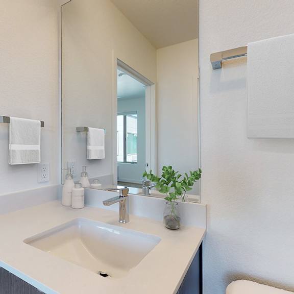 a bathroom with a sink and mirror.
