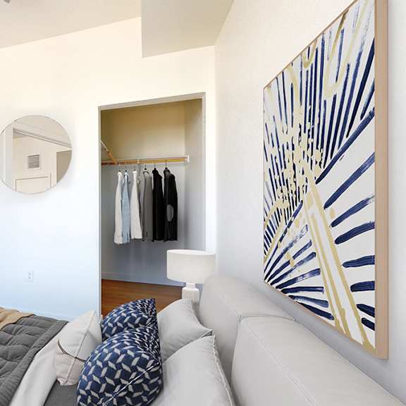 a bedroom with a large bed and a painting on the wall.