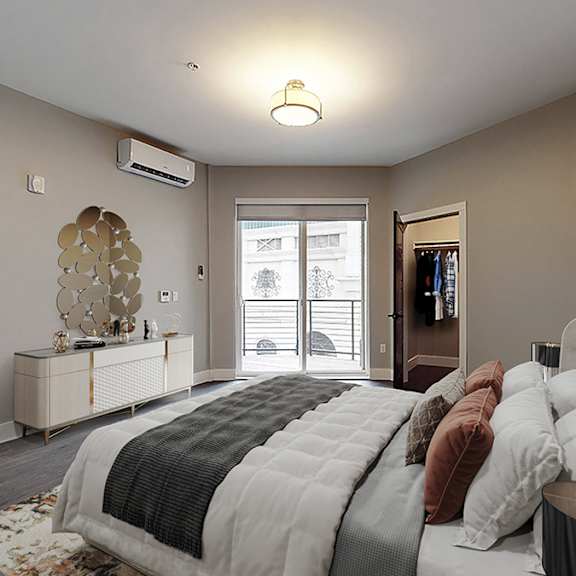 a bedroom with a large bed and a painting on the wall.