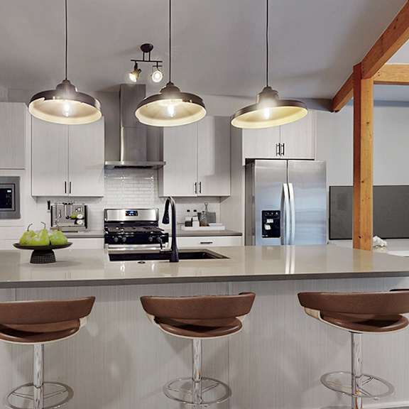 a modern kitchen with a bar stool and a painting on the wall.
