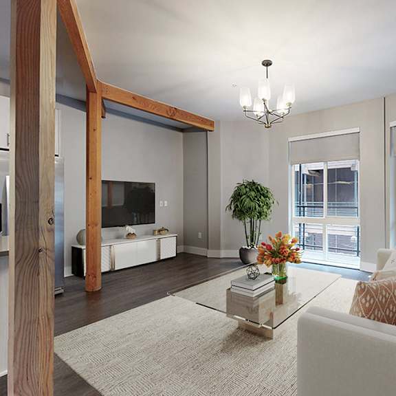 a modern living room with a white couch and a coffee table.