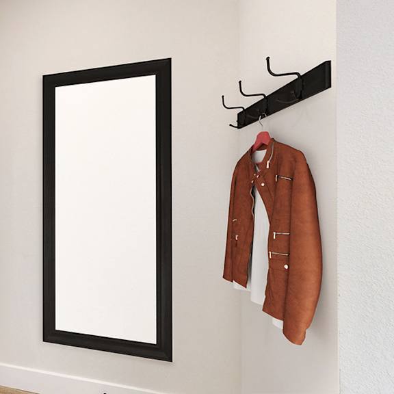 a white door with a black frame and a coat hanging on a hook.