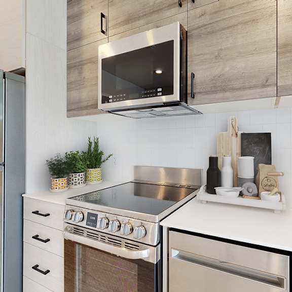 a modern kitchen with a stainless steel refrigerator and a stove top oven.