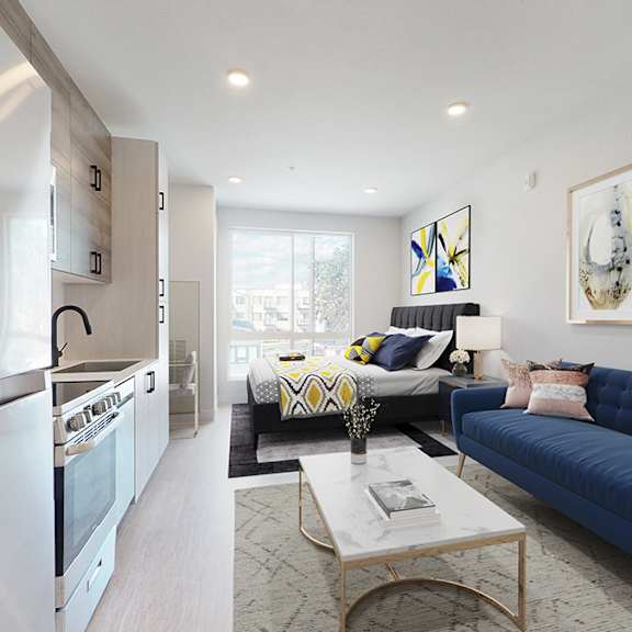 a modern living room with a blue couch and a coffee table.